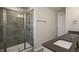 This bathroom features a glass enclosed shower with gray tile and a modern vanity with dual sinks at 1825 Hinesley Dr, Durham, NC 27703