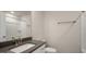 A well-appointed bathroom features modern fixtures, a shower-tub combo, and neutral color scheme at 1825 Hinesley Dr, Durham, NC 27703