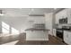 Spacious kitchen featuring a center island, stainless steel appliances, and beautiful hardwood floors at 1825 Hinesley Dr, Durham, NC 27703