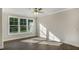 Sun-drenched living room with hardwood floors, recessed lighting, large windows, and neutral paint at 1825 Hinesley Dr, Durham, NC 27703