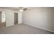 A spacious bedroom features neutral walls and carpet, plus a ceiling fan for added comfort at 1829 Hinesley Dr, Durham, NC 27703