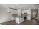 Spacious kitchen with a center island, stainless steel appliances, and wood-look flooring at 1829 Hinesley Dr, Durham, NC 27703