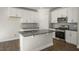 Well-equipped kitchen with stainless steel appliances and a central island at 1829 Hinesley Dr, Durham, NC 27703