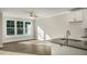 Open concept kitchen and living room with hardwood floors and natural light at 1829 Hinesley Dr, Durham, NC 27703
