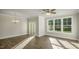 Living room with hardwood floors, modern lighting and large windows at 1829 Hinesley Dr, Durham, NC 27703