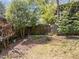 The backyard has a wooden fence and plenty of foliage, with a good balance of sun and shade at 417 Elm St, Raleigh, NC 27604