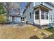 Backyard patio and exterior views of the house with stone pavers and a grill at 417 Elm St, Raleigh, NC 27604
