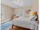A bedroom with hardwood floors, neutral walls, and a ceiling fan for added comfort at 417 Elm St, Raleigh, NC 27604
