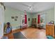 A spacious bedroom featuring two windows, hardwood floors, and ample room for activities at 417 Elm St, Raleigh, NC 27604
