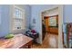 Bright breakfast nook with a view into the kitchen, with wood floors and natural light at 417 Elm St, Raleigh, NC 27604