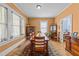 Bright dining room with hardwood floors and plenty of natural light from multiple windows at 417 Elm St, Raleigh, NC 27604