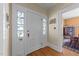 Home entryway featuring a beautiful front door with decorative glass and hardwood floors at 417 Elm St, Raleigh, NC 27604