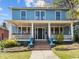 Beautiful two-story home with a spacious front porch, columns, and well-maintained landscaping at 417 Elm St, Raleigh, NC 27604