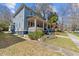 Two-story home with a porch, garden, and a paved walkway leading to the street at 417 Elm St, Raleigh, NC 27604