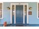 Close-up of the elegant front door with sidelights and decorative lighting fixtures at 417 Elm St, Raleigh, NC 27604