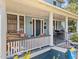 Comfortable seating area on the front porch, perfect for relaxing and enjoying the outdoors at 417 Elm St, Raleigh, NC 27604