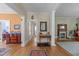 Hallway with hardwood floors connecting the home's living spaces and kitchen at 417 Elm St, Raleigh, NC 27604