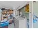 A laundry room with a washer, dryer, ample storage, and a dedicated utility space at 417 Elm St, Raleigh, NC 27604