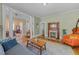 Inviting living room with hardwood floors, a cozy fireplace, and large windows at 417 Elm St, Raleigh, NC 27604