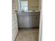 Bathroom with gray cabinets, dual sinks and hexagon tile flooring at 1113 Mountain Crown St, Durham, NC 27703