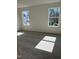 Bedroom with carpeted floors and natural light from two windows at 1113 Mountain Crown St, Durham, NC 27703