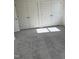 Carpeted bedroom with three closet doors for ample storage at 1113 Mountain Crown St, Durham, NC 27703