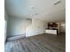 Open-concept space showcasing sleek flooring and staircase to upper level at 126 Parker Ln, Mebane, NC 27302