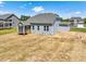 The backyard features a screen porch and ample space for gardening and outdoor activities at 155 Shelby Meadow Ln, Angier, NC 27501