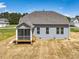 Rear view featuring a screened porch, offers the perfect space for relaxation and outdoor enjoyment at 155 Shelby Meadow Ln, Angier, NC 27501