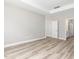 Spacious bedroom featuring a tray ceiling, wood-look flooring and two entryways at 155 Shelby Meadow Ln, Angier, NC 27501