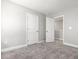 Neutral bedroom with plush carpeting, soothing paint colors, and white doors and trim at 155 Shelby Meadow Ln, Angier, NC 27501