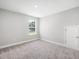 Bright bedroom featuring a window and neutral walls, providing a blank canvas for personalization at 155 Shelby Meadow Ln, Angier, NC 27501