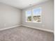 Cozy bedroom with plush carpeting, soothing paint colors, and natural light from the double windows at 155 Shelby Meadow Ln, Angier, NC 27501