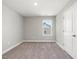 Neutral bedroom featuring plush carpeting, soothing paint colors, and a single window at 155 Shelby Meadow Ln, Angier, NC 27501