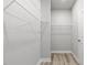 Spacious walk-in closet with wire shelving and wood-look floors at 155 Shelby Meadow Ln, Angier, NC 27501