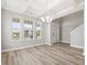 Open dining room with large windows, coffered ceiling and staircase at 155 Shelby Meadow Ln, Angier, NC 27501