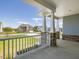 Spacious porch with stone accents and stylish white railings at 155 Shelby Meadow Ln, Angier, NC 27501