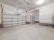 Three car garage with concrete floors and light-colored walls at 155 Shelby Meadow Ln, Angier, NC 27501