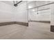 Unfinished three car garage with concrete floors and cinder block perimeter at 155 Shelby Meadow Ln, Angier, NC 27501