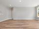 Spacious living room featuring luxury vinyl plank flooring, neutral paint, and a modern aesthetic at 155 Shelby Meadow Ln, Angier, NC 27501