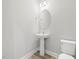 Charming powder room with modern fixtures, and neutral color palette at 155 Shelby Meadow Ln, Angier, NC 27501