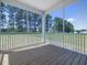 View from the screened in porch, overlooking the backyard and surrounding trees at 155 Shelby Meadow Ln, Angier, NC 27501