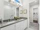Elegant bathroom with double vanity, gray quartz countertops, and a tiled walk-in shower at 2021 Abbeyhill Dr # 66, Raleigh, NC 27610