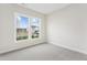 Bright, carpeted bedroom features a large window providing ample natural light and a view of the outdoors at 2021 Abbeyhill Dr # 66, Raleigh, NC 27610