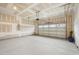 Spacious garage with a smooth concrete floor, insulated ceiling, and an open garage door at 2021 Abbeyhill Dr # 66, Raleigh, NC 27610