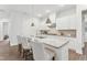 Modern kitchen featuring a large island, white cabinets, stainless steel appliances, and pendant lighting at 2021 Abbeyhill Dr # 66, Raleigh, NC 27610