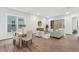 Open-concept living space with hardwood floors, stylish furnishings, and abundant natural light at 2021 Abbeyhill Dr # 66, Raleigh, NC 27610