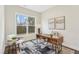 Stylish office space featuring a large window, modern desk, neutral tones, and natural light at 2021 Abbeyhill Dr # 66, Raleigh, NC 27610