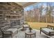 Cozy outdoor patio with stone fireplace and seating, perfect for relaxing and enjoying the view at 2021 Abbeyhill Dr # 66, Raleigh, NC 27610
