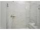 Modern shower features tiled walls, glass surround, built-in bench, and a handheld sprayer at 2021 Abbeyhill Dr # 66, Raleigh, NC 27610